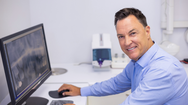 DSO dentist at computer