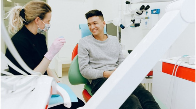 Dentist and patient in exam chair